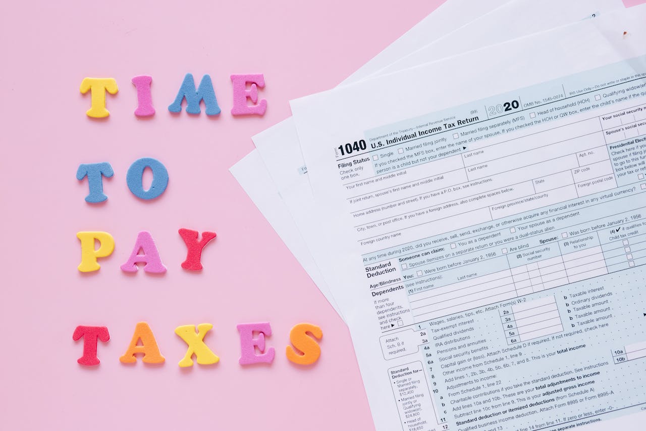 1040 tax forms with colorful 'Time to Pay Taxes' letters.